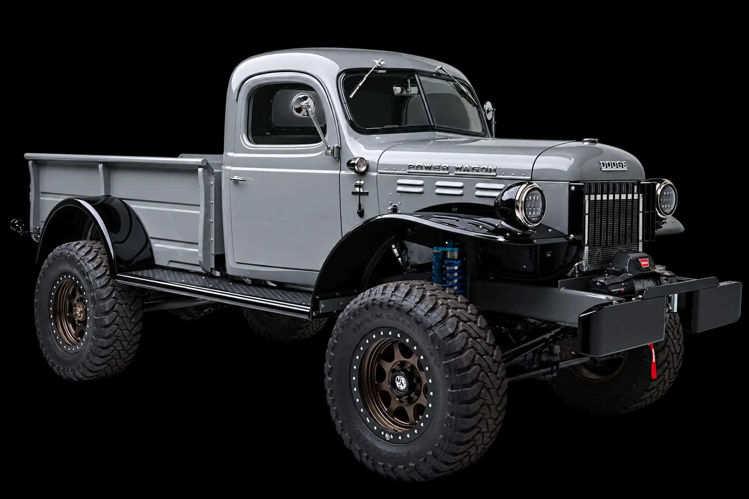 Silver two-door Dodge Power Wagon with black fenders and bronze wheels