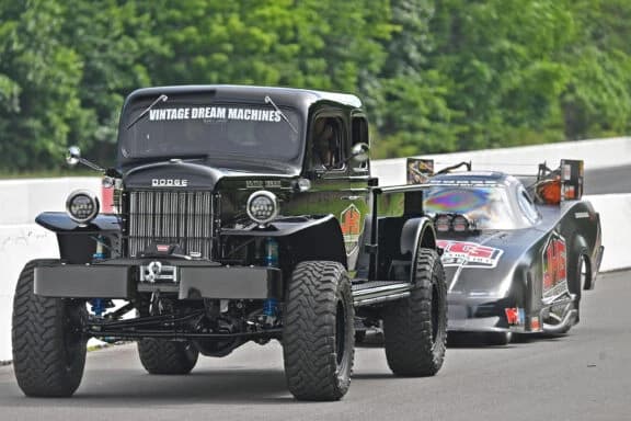 Black VDM Power Wagon on the Bristol track with a Funny Car behind it