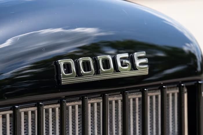 Chrome Dodge lettering above SYNISTA’s black grille