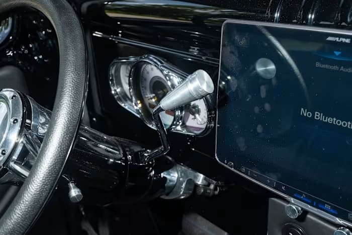 Alpine touchscreen beside the instrument cluster and column shifter — photo 10 of 23