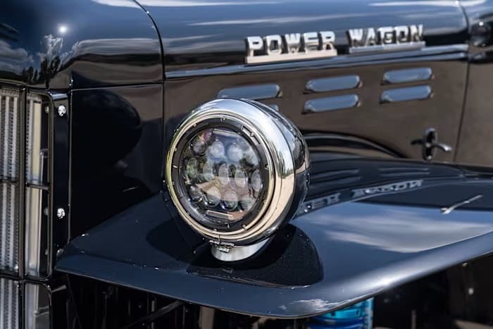 Round LED headlight beside the chrome Power Wagon hood badge — photo 19 of 23