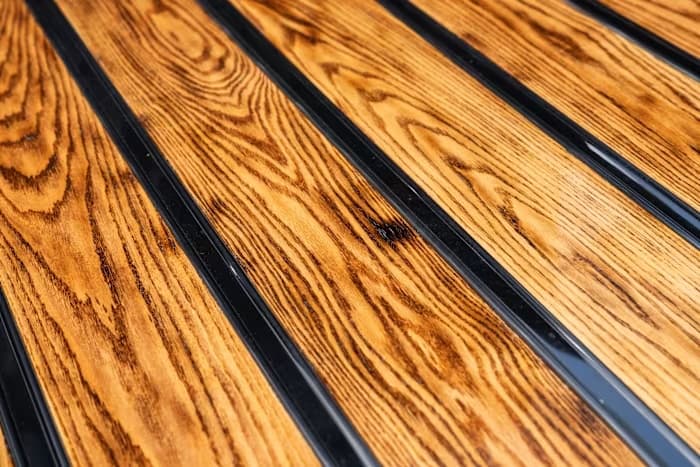 Wood grain and polished metal strips in SYNISTA’s pickup bed
