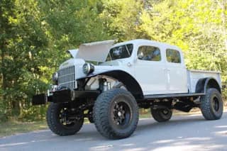 Low front three-quarter view of the four-door Power Wagon with the hood open — photo 40 of 40