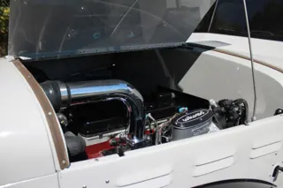 Wider view into the open engine bay beneath the raised hood — photo 23 of 40