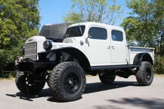 Front three-quarter view of the Power Wagon with its side-opening hood raised — photo 21 of 40