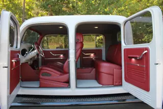 Both driver-side doors open to reveal the red front and rear seating — photo 7 of 40