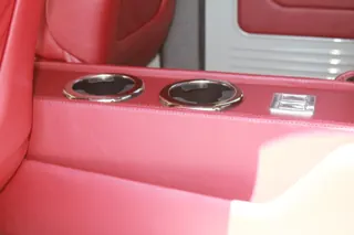 Close-up of the rear center console and polished cupholders — photo 17 of 40