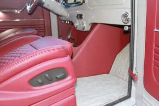 Front seat cushion and power-seat controls beside the center console — photo 20 of 40