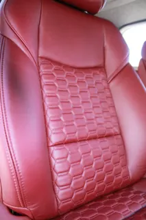 Close-up of the patterned stitching in the red front seat — photo 13 of 40