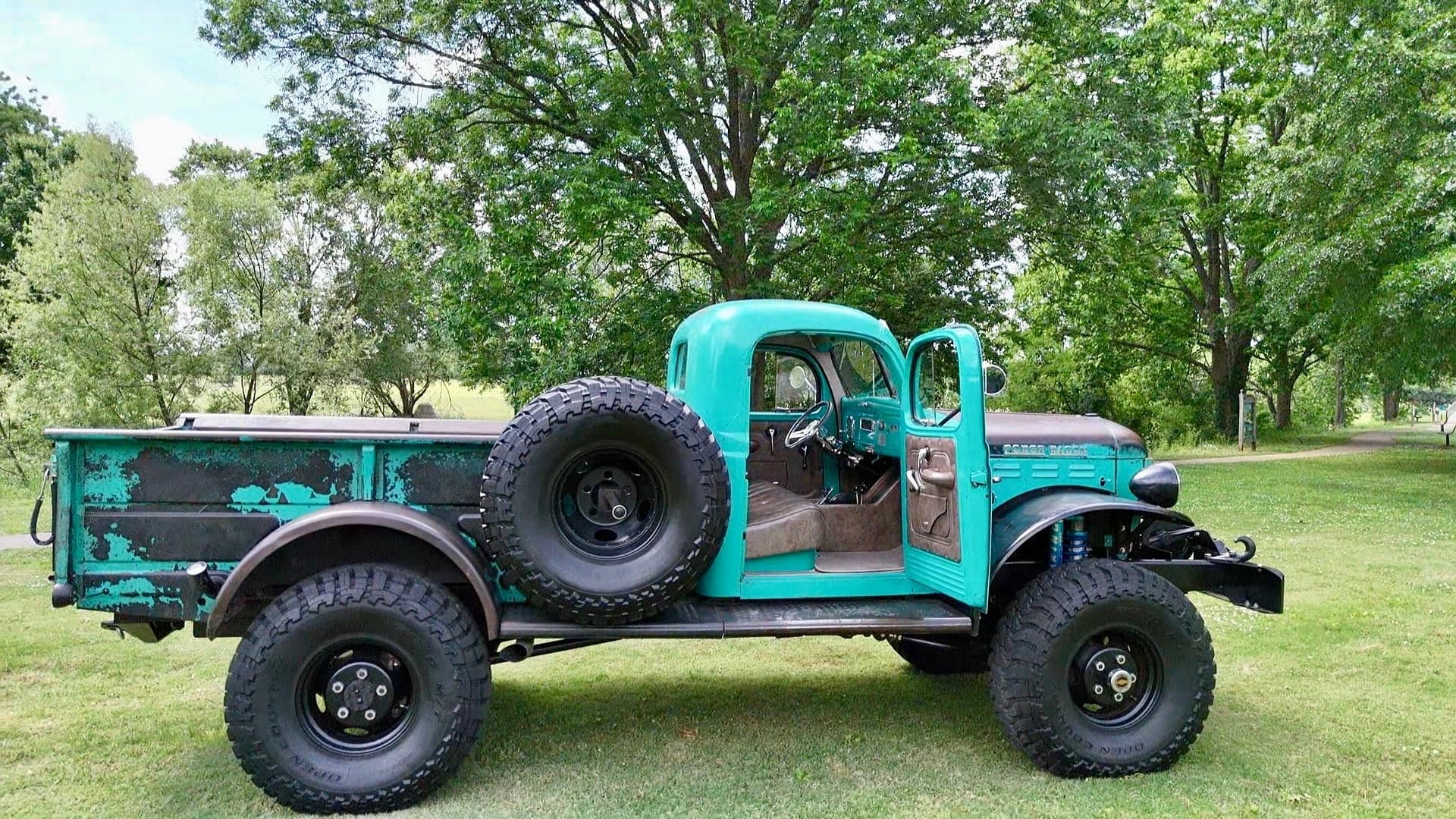 Side view of TIFFANY with the cab door open and brown interior visible — photo 5 of 7